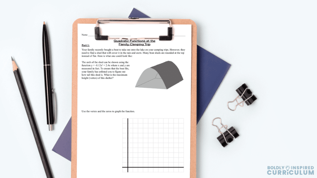 quadratic functions real world application mockup on a clipboard with pens and binder clips